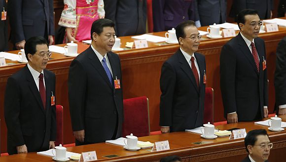(From left to right) China's President Hu Jintao, China's Communist Party Chief Xi Jinping, China's Premier Wen Jiabao and Vice-Premier Li Keqiang sing the national anthem during the opening ceremony of National People's Congress