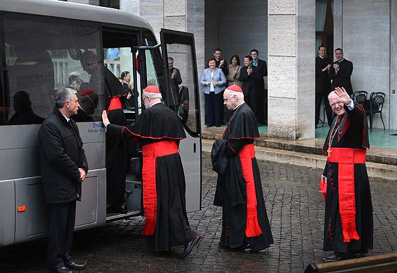 American Cardinals (left to right) Sean P O'Malley, Keith O'Brien and Timothy M Dolan board a bus to take them from the North American College to St Peter's Basilica where a Pro Eligendo Romano Pontifice Mass will be celebrated before they enter the Conclave to decide who the next pope will be on March 12, 2013 in Rome, Italy.