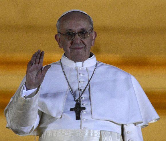 Newly elected Pope Francis, Cardinal Jorge Mario Bergoglio of Argentina appears on the balcony of St. Peter's Basilica after being elected by the conclave of cardinals