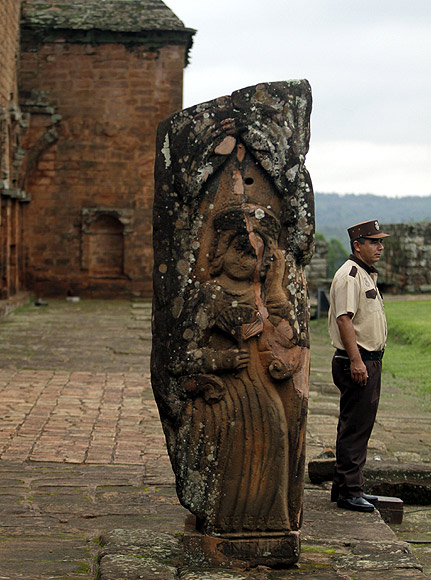 A security guard stands at the ruins of the Jesuit mission at Santisima Trinidad del Parana, Paraguay. The mission was built in 1706.