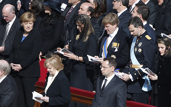 Prince Willem-Alexander (third right) and Princess Maxima of the Netherlands, Spain's Prince Felipe (second right) and Princess Letizia and Germany's Chancellor Angela Merkel attend the inaugural mass of Pope Francis at the Vatican.