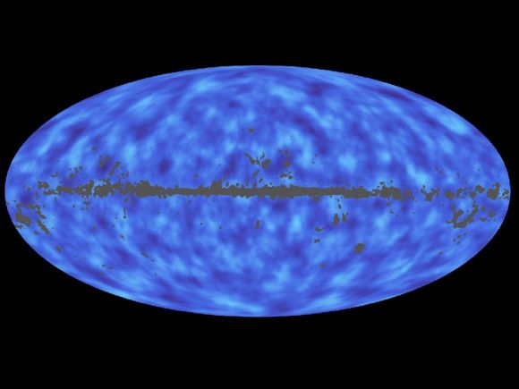 This full-sky map from the Planck mission shows matter between Earth and the edge of the observable universe. Regions with less mass show up as lighter areas while regions with more mass are darker.