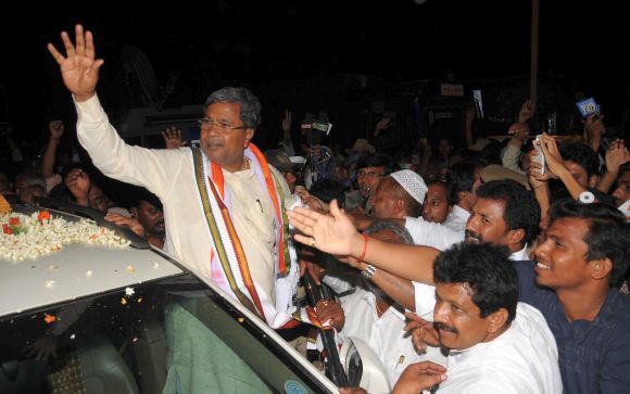 Karnataka Chief Minister Siddaramaiah waves out to supporters. Photograph: Madhusudhar S R