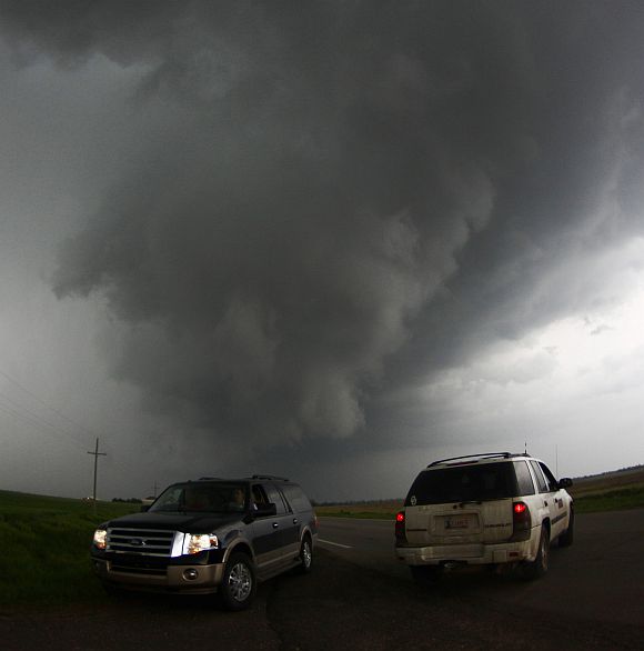 Storm chasers get close to a tornadic thunderstorm, one of several tornadoes that touched down