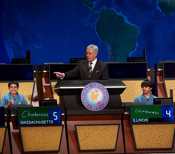 A thumbs-up from National Geographic Bee winner Sathwik Karnik, left, of Massachusetts as he correctly answers the final question posed by moderator Alex Trebek. The runner-up was Illinois' Conrad Oberhaus