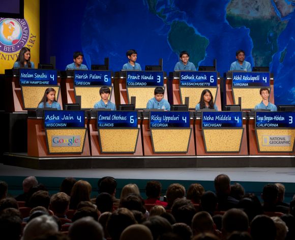 Bee moderator Alex Trebek quizzes the top10 finalists at the 25th National Geographic Bee held at The National Theatre in Washington