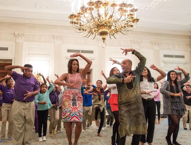 First Lady Michelle Obama joins students for a Bollywood dance in the State Dining Room of the White House along with choreographer Nakul Mahajan