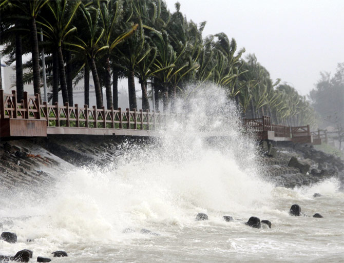 A wave surges under the influence of Typhoon Haiyan, in Haikou, south China's Hainan province