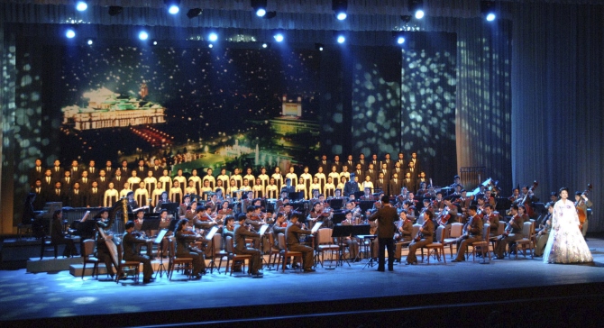 Members of the now disbanded Unhasu Orchestra perform the 2012 New Year's concert, 'The Cause of the Sun Will Be Immortal', at the East Pyongyang Grand Theatre in Pyongyang in this photograph taken on January 5, 2012.