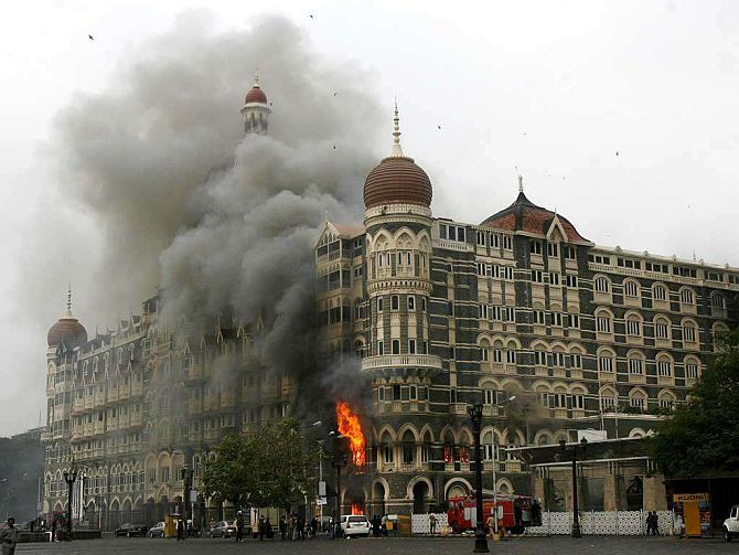 The iconic Taj Hotel burning during the infamous Mumbai terror attack of 2008.