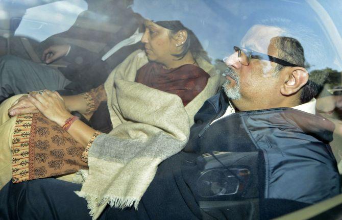 Dentists Rajesh Talwar and wife Nupur are taken to court in Ghaziabad, on the outskirts of New Delhi