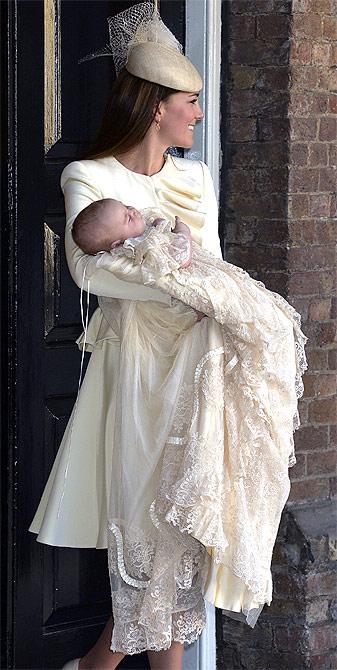 Britain's Catherine, Duchess of Cambridge carries her son Prince George after his christening at St James's Palace in London