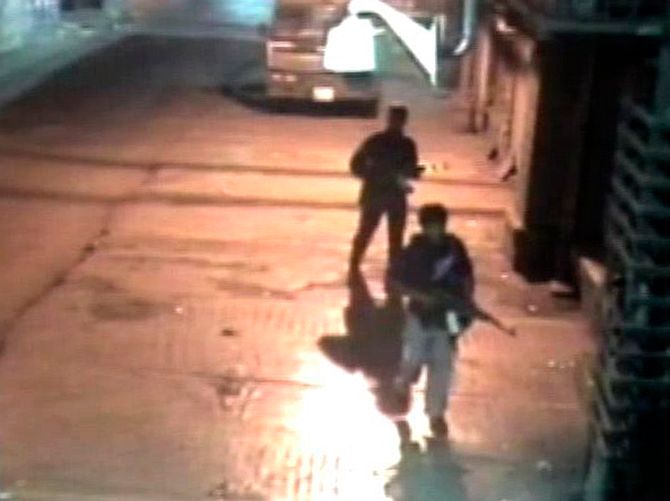 Closed circuit television footage shows Ajmal Kasab and Abu Ismail after their shooting spree at the Chhatrapati Shivaji Terminus, November 26, 2008.