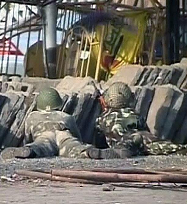 A video grab shows army personnel taking positions in front of the Taj Mahal hotel in Mumbai on November 27, 2008