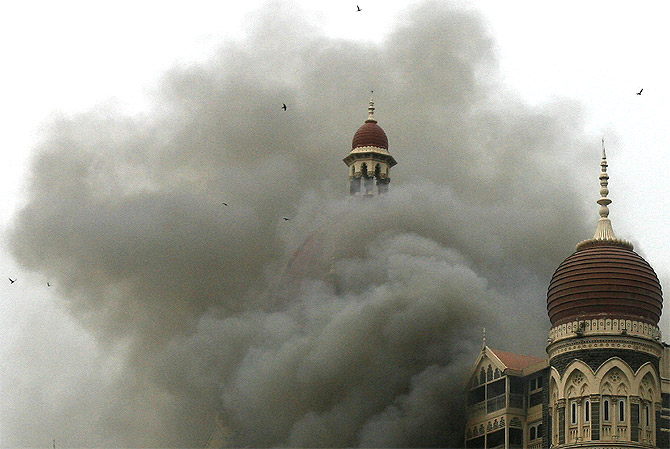The Taj Mahal hotel is seen engulfed in smoke on November 29, 2008