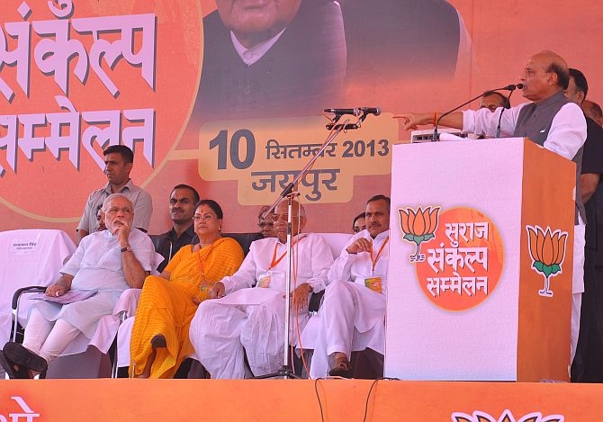 BJP President Rajnath Singh with the party's chief ministerial candidate Vasundhara Raje and PM candidate Narendra Modi at a poll rally in Jaipur