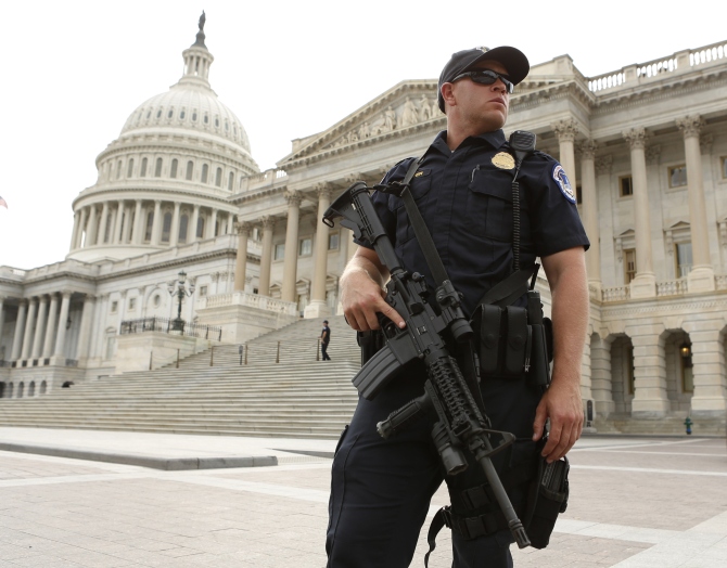 A police officer stands guard following a shooting near the US Capitol in Washington