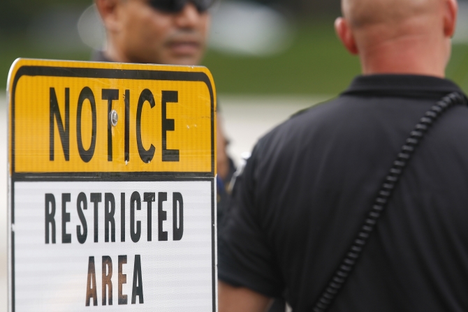 Law enforcement officers secure an entrance to the White House and Treasury Department where a car chase began, ending in gunfire outside the US Capitol in Washington