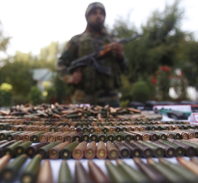 Arms and ammunition recovered during the Keran operation is displayed at the press conference