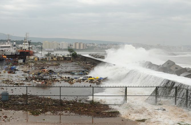 Waves crash onto the shore at a fishing harbour in Visakhapatnam district after cyclone Phailin hit India's east coast
