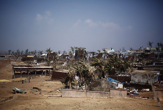 A view of damaged houses is pictured after Cyclone Phailin hit Arjyapalli village, in Ganjam district
