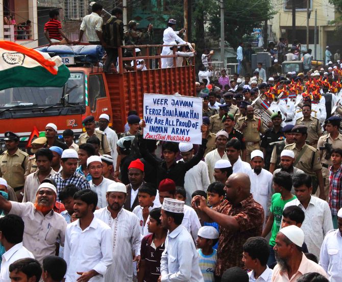 Mourners display anti-Pakistan banners at Lance Naik Firoz Khan's procession in Hyderabad