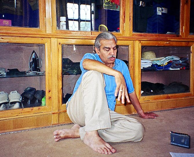 Dr N K Kalia, sitting in a room full of his son's personal items that were returned to him, a photograph shot in 2004.