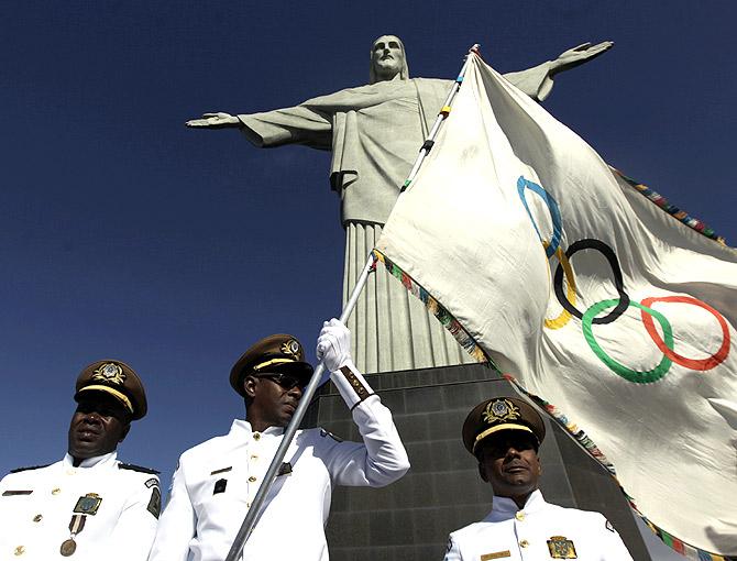 The Olympic flag at the Christ the Redeemer statue in  Rio de Janeiro.