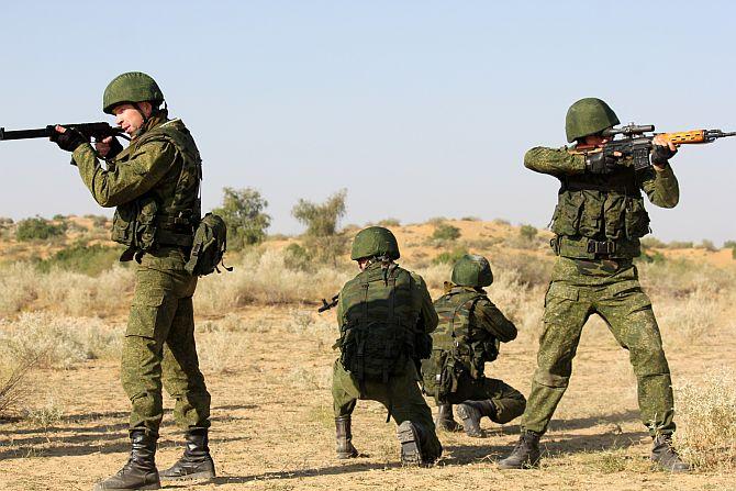 Russian troops take positions during a drill