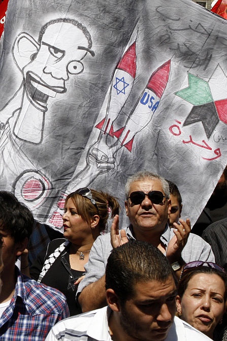 Protesters from leftist parties demonstrate against military strikes on the Syrian government and to show their support for the regime of Syria's President Bashar al-Assad, after Friday prayers in Amman