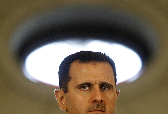 Syria's President Bashar al-Assad attends a news conference