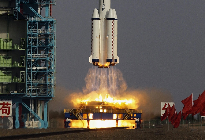 The Long March II-F rocket loaded with a Shenzhou-9 manned spacecraft carrying Chinese astronauts Jing Haipeng, Liu Wang and Liu Yang lifts off from the launch pad in the Jiuquan Satellite Launch Center, Gansu, China