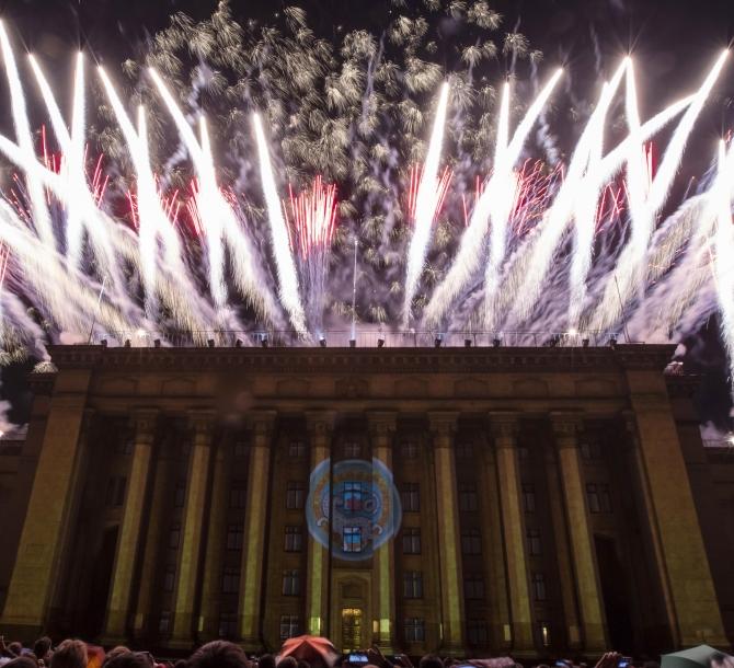 Fireworks explode in the sky above the Kazakh-British Technical University at a fireworks and light show during City Day in Almaty