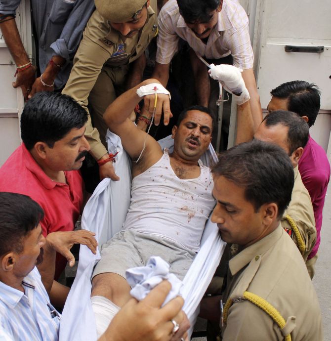 A policeman injured in a fidayeen strike is rushed to a hospital for treatment, in Jammu.