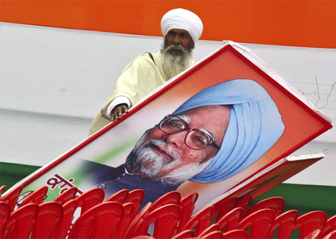 A supporter with a billboard of Dr Manmohan Singh in Punjab, January 19, 2012.