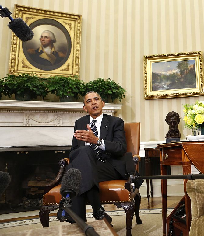 Obama speaks to reporters about Syria during his meeting with Prime Minister Manmohan Singh