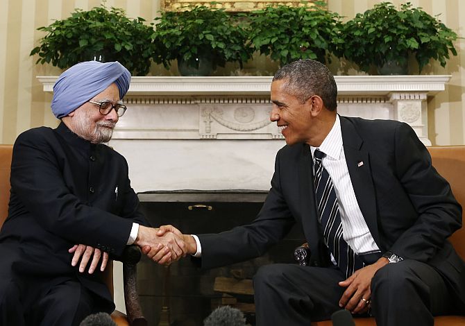 Obama shakes hands with Dr Singh in the Oval Office of the White House
