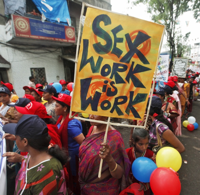 Participants take part in a rally as part of the week-long sex workers' freedom festival at the Sonagachi Red-light area in Kolkata.