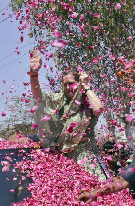 Sonia Gandhi is showered with rose petals after filing her nomination in Rae Bareli.