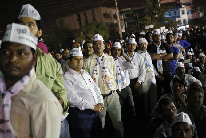 AAP supporters listen to their party leader Arvind Kejriwal during a public rally ahead of the general elections.
