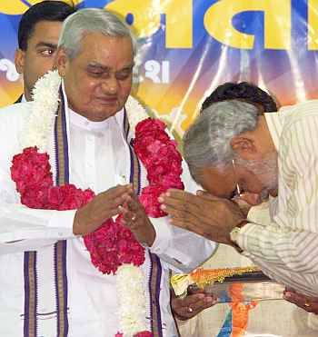 Narendra Modi, then Gujarat's chief minister, pays obeisance to then prime minister Atal Bihari Vajpayee