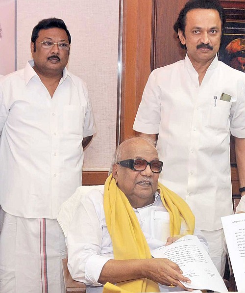 In happier times: DMK chief M Karunanidhi, flanked by his sons, M K Stalin, right, and M K Azhagiri.