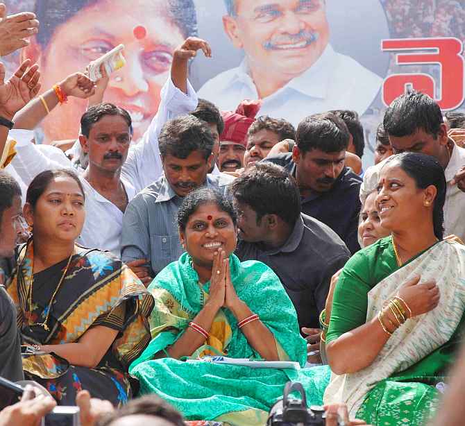 Vijayamma greets supporters during a campaign rally in Vishakhapatanam.