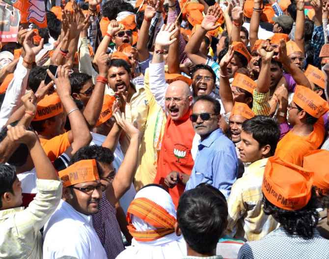 BJP supporters cheer for Modi in Varanasi on Thursday