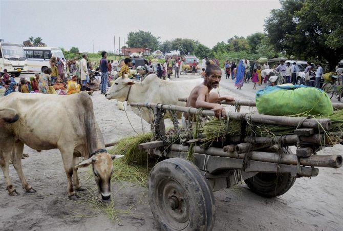 Flood affected villagers have come out on the roads at Birpur due to danger of flood after raised level of water in Kosi river.