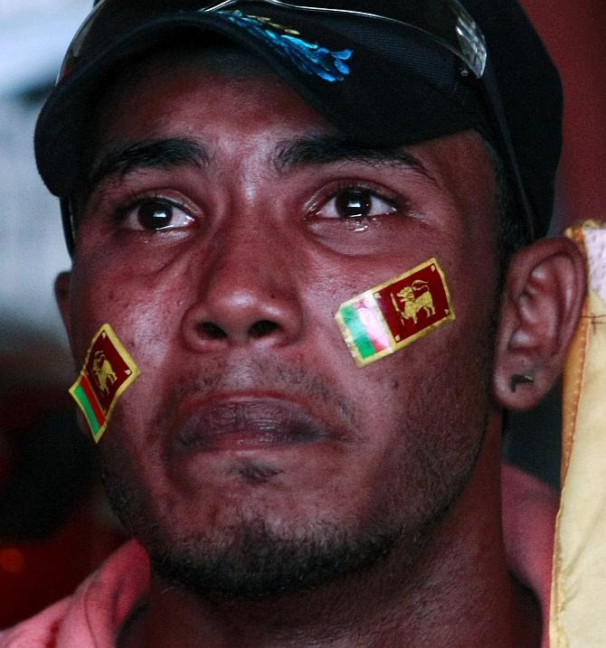 A Sri Lanka cricket fan reacts after the team's loss 