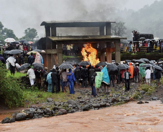 Mass funeral of the victims near the site of a landslide in Malin village in Pune