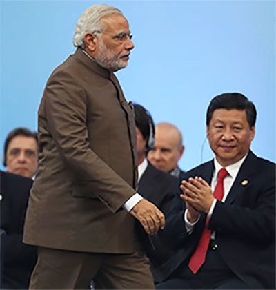 Chinese President Xi Jinping applauds Prime Minister Narendra Modi at the BRICS Summit in Fortaleza, Brazil, July 15, 2014. Photograph: Nacho Doce/Reuters
