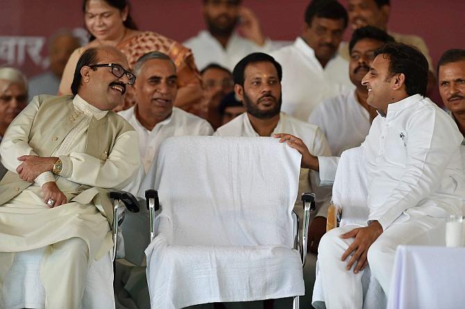 UP Chief Minister Akhilesh Yadav talks with Amar Singh at the inauguration of Janeshwar Misra Park in Lucknow on Tuesday