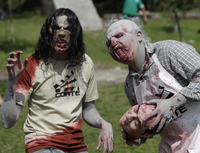 Men dressed as zombies take part in the Run for Your Lives 4 km obstacle course race in El Ajusco, on the southern outskirt of Mexico City.